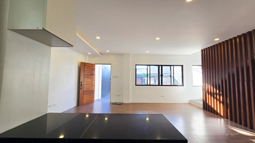Spacious and well-lit living room with modern finishes in a brand new Las Piñas duplex