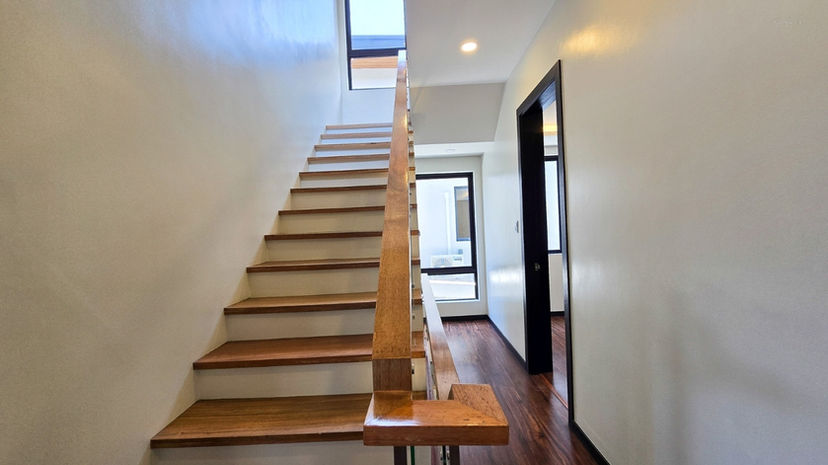 Modern 3-storey luxury house exterior in BF Homes Parañaque with sleek facade and 3-car garage