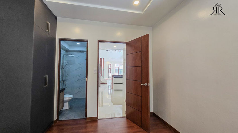 Spacious bedroom with natural light and clean modern finishes