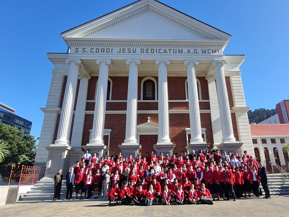 Bishop Viard and Sacred Heart Students gathered outside the Cathedral with Monsignor Gerard Burns