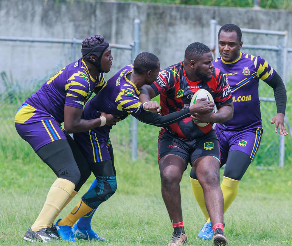 File Photo: Hakeem Richards (Dragons) tussles with Jerome Laird (JDF)