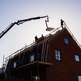 construction-workers-building-a-brick-house-with-c-2026-03-09-23-47-16-utc (1).webp