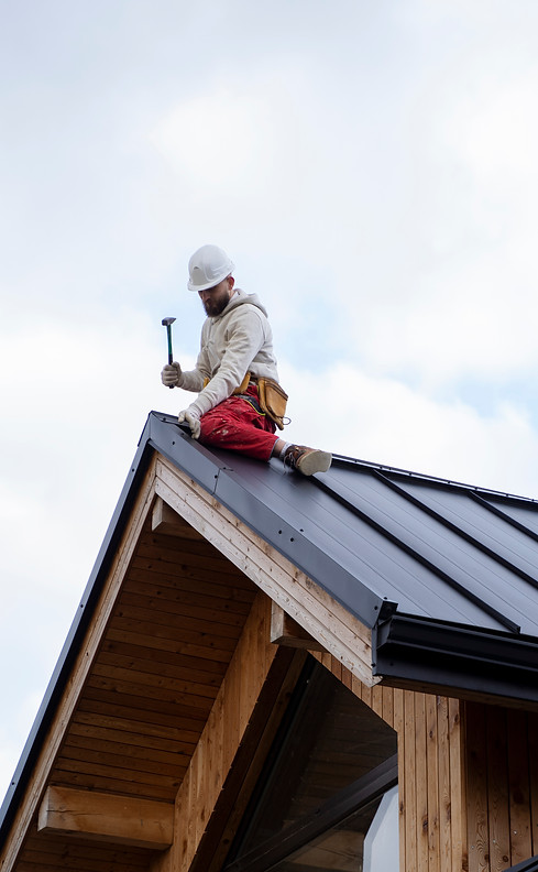 full-shot-man-working-roof.jpg