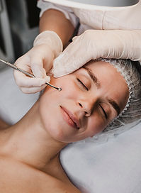 woman-getting-skincare-procedure-wellness-center.jpg