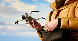 modern-traveler-creating-content-filming-valley-with-his-drone.jpg