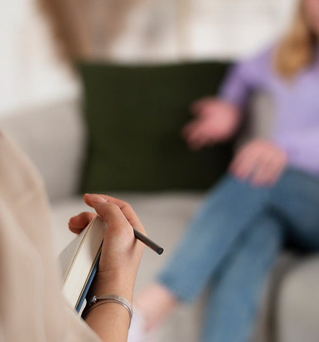 sided-view-young-girl-talking-therapist.jpg