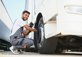 indian-mechanic-unscrews-wheel-truck-pneumatic-wre-2026-01-08-23-37-37-utc.jpg