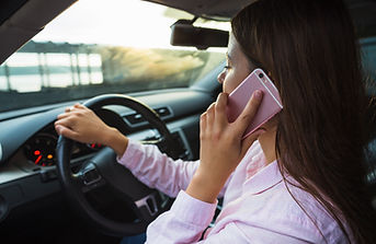 woman-talking-cellphone-driving-car.jpg
