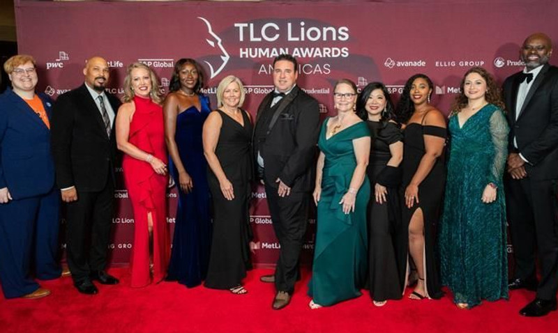 Group photo of 11 people at the TLC Lions Awards in New York, including Avanade’s Chief Officers, Inclusion & Diversity and Marketing teams, and fellow nominees. Everyone is dressed in evening cocktail attire and suits, celebrating the event together