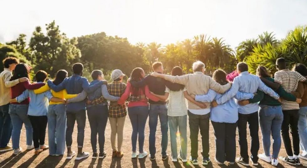 community of people with arms around each other