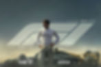 A race car driver stands confidently in front of a sleek car, with text: "The Movie," "June 27," "Filmed for IMAX," set in a foggy backdrop.