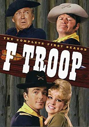 Dvd cover with 3 men dressed as cowboys and one woman