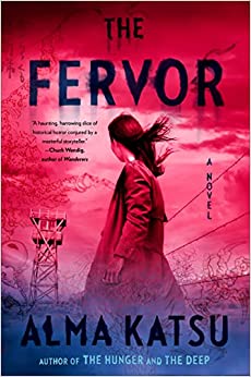 Book cover with a woman standing in a long coat in front of a guard tower and a barbed wire fence