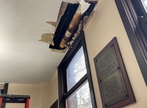 Photo of the whole in the Audio/Visual Room ceiling due to a catastrophic failure of the pipe.