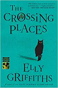 Green book cover with a black owl with orange eyes