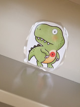 Photo of a dinosaur with a letter and number for the dinosaur scavenger hunt