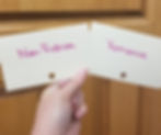 Photo of a hand holding the Non-Fiction and Romance cards.
