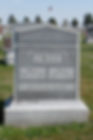 Gravestone of Mary and Milo Twist in a cemetery with American flag, trees, and other graves in the background. Inscription about Milo's birth.