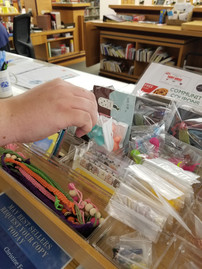Photo of a hand choosing a prize from the treasure box