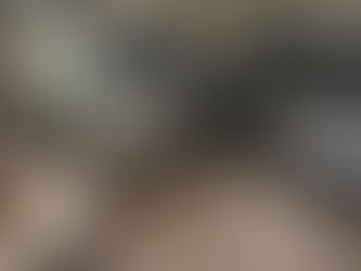 Rustic kitchen scene with a wooden table holding bread, jarred eggs, utensils, a lace-covered pot, spice jars, and a spoon. Vintage vibe.