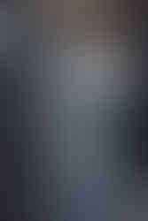 Book cover for The Knight and the Month by Rachel Gillig featuring a woman with one half of her body dressed in armor and the other half dressed in a blue gown.