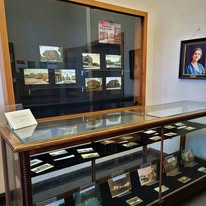 Local History Display case in the periodicals room containing artifacts from the archives