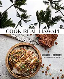 Book cover with a bowl of cooked chicken and rice with palm trees in the background