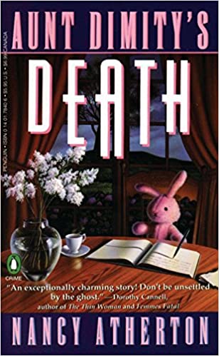 Book cover with a stuffed rabbit sitting at a table with and open book, cup of tea, and vase of flowers