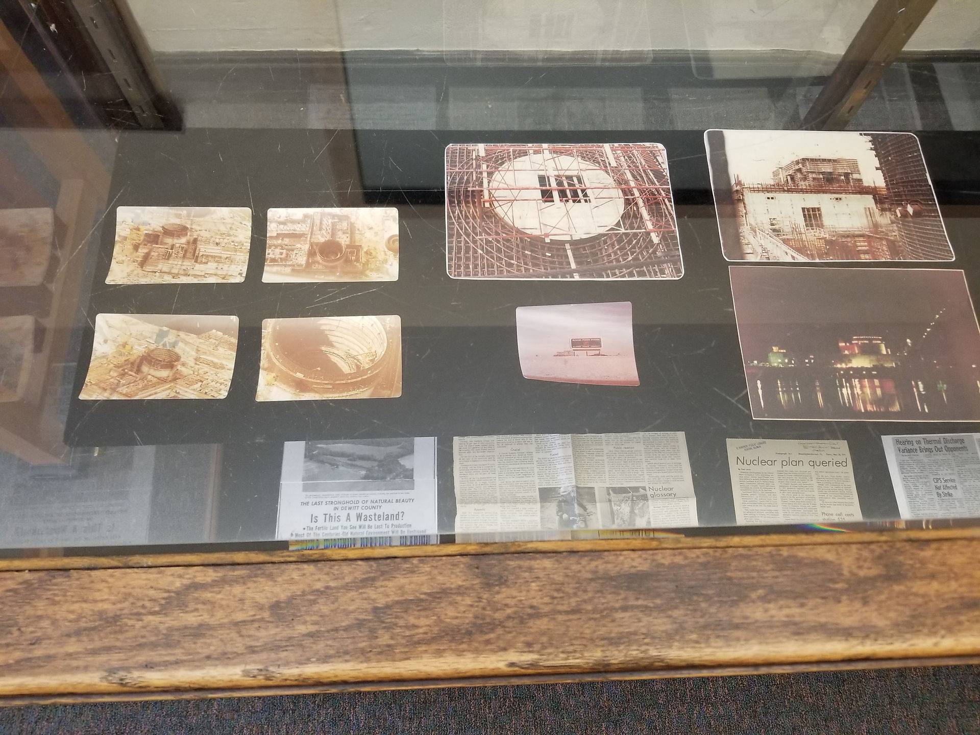 Local History Display Case in Audio/Visual Room with numerous photos related to local Clinton history.