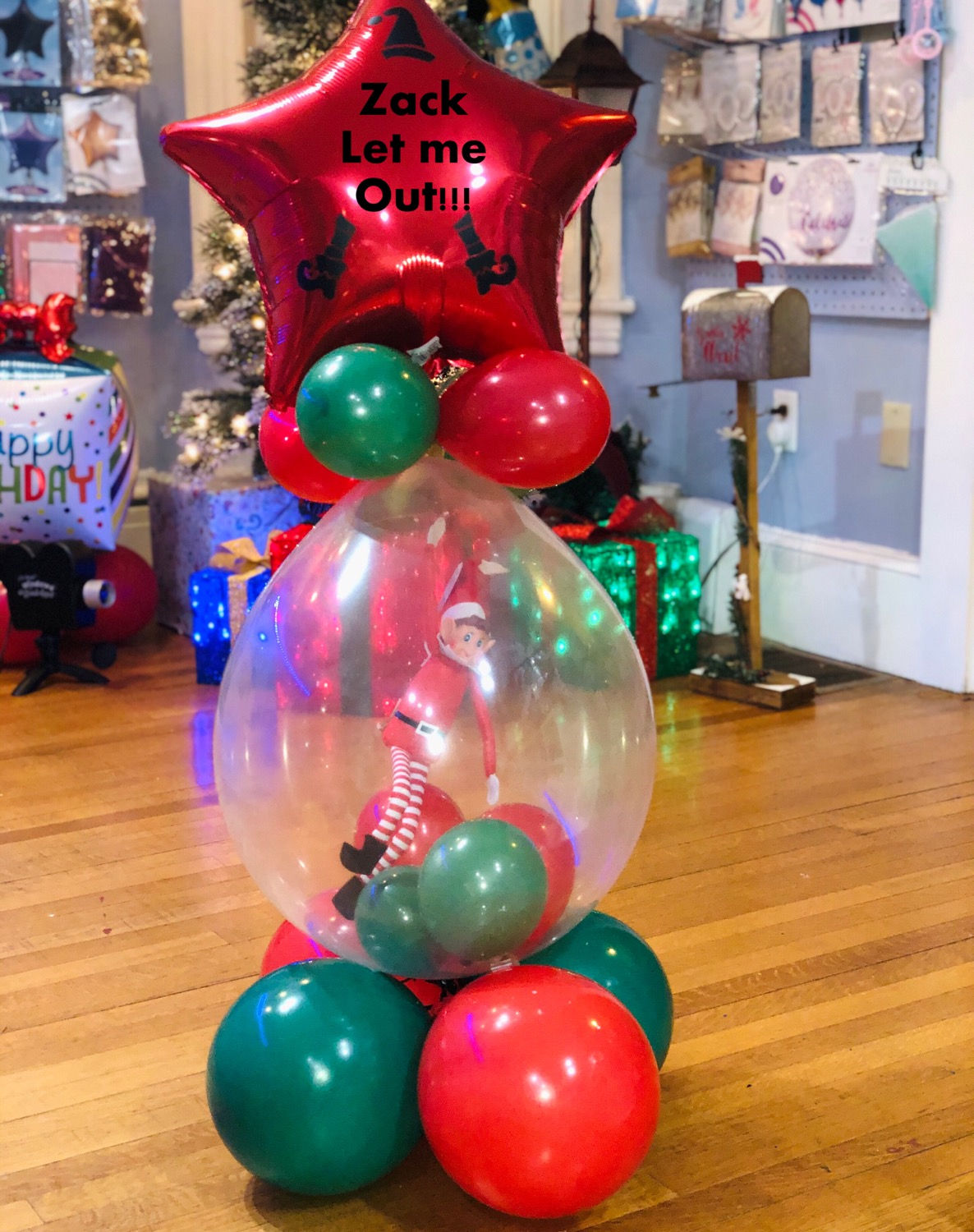 (You bring in elf) Let me out!! Balloon