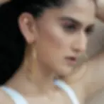 Woman wearing gold hoop earrings