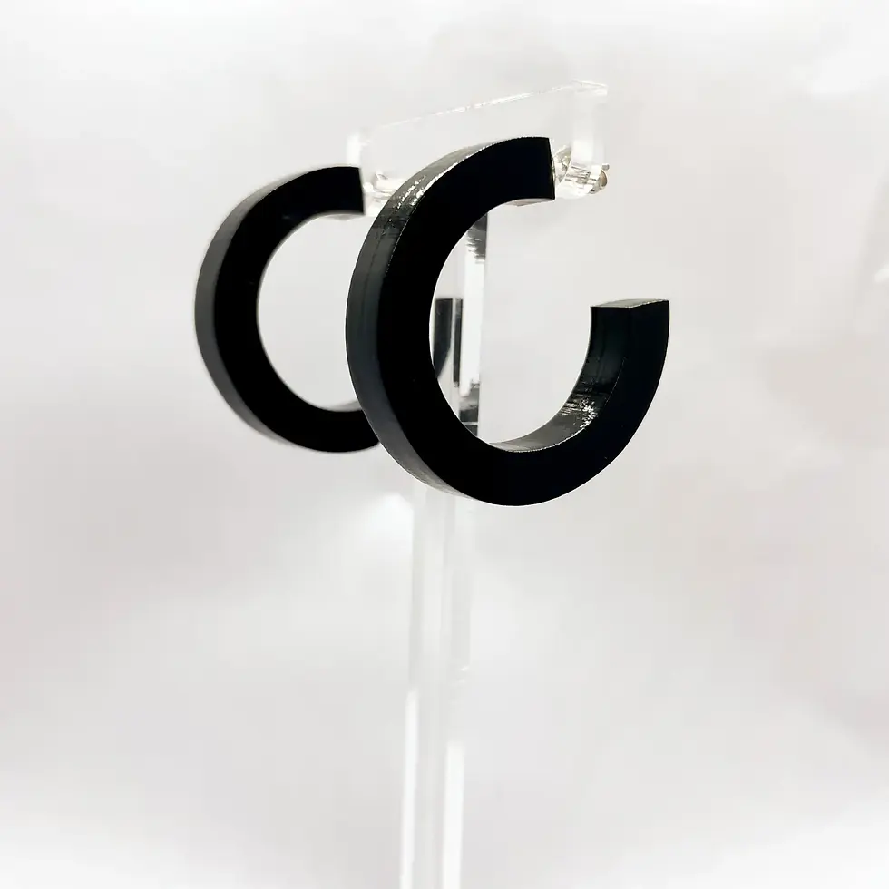 Black hoop earrings on display