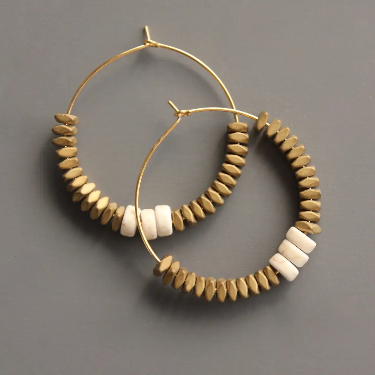 Gold hematite and white stone hoop earrings