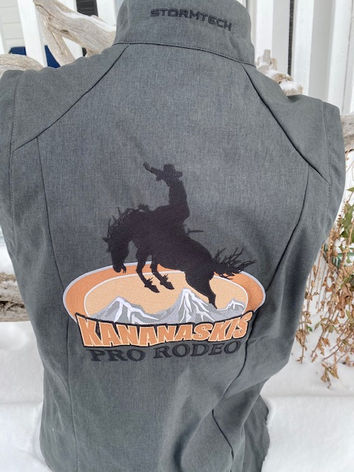 Kananaskis Pro Rodeo logo on a grey Stormtech vest
