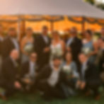 Zach, a videographer at HBZ Media, posing in front of a wedding party he filmed.