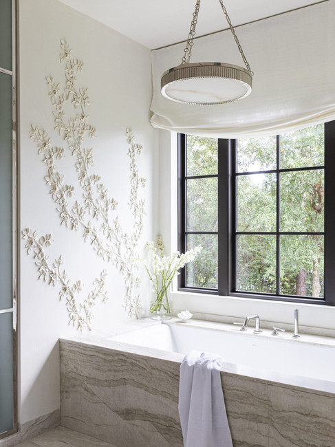 Bathroom with sculptural plaster floral wall detailing, freestanding tub, and layered timeless design