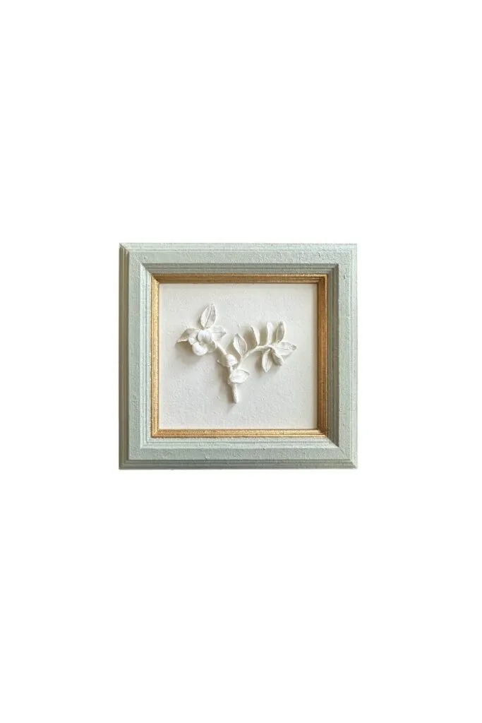 Small framed plaster floral artwork with delicate botanical relief detailing