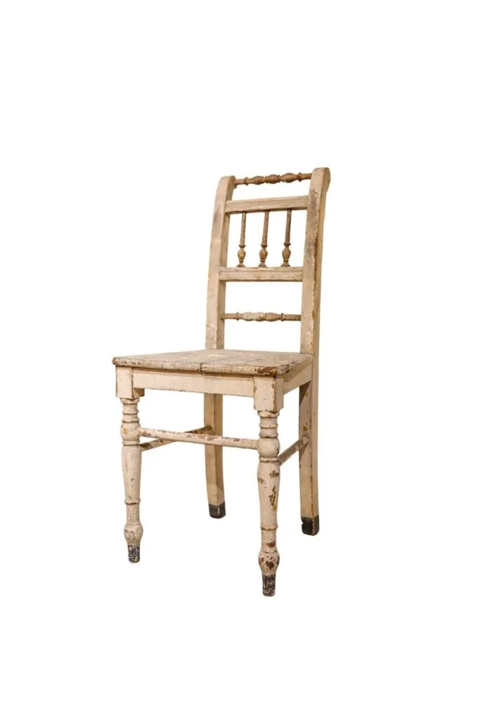 Vintage wood dining chair with turned details and aged patina