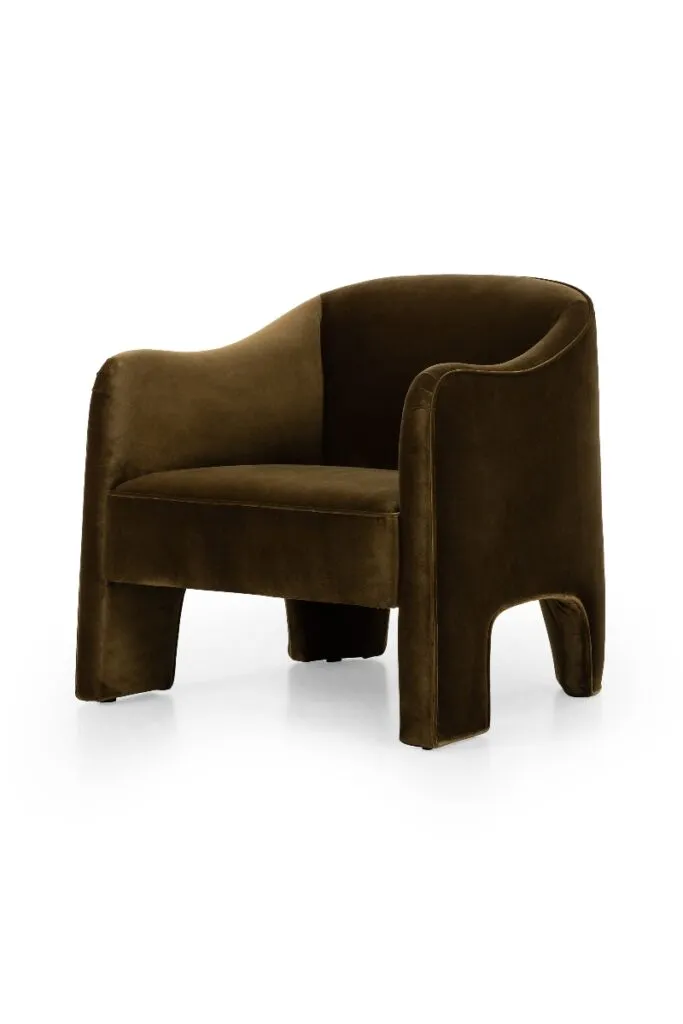 Curved accent chair in rich brown upholstery with sculptural silhouette