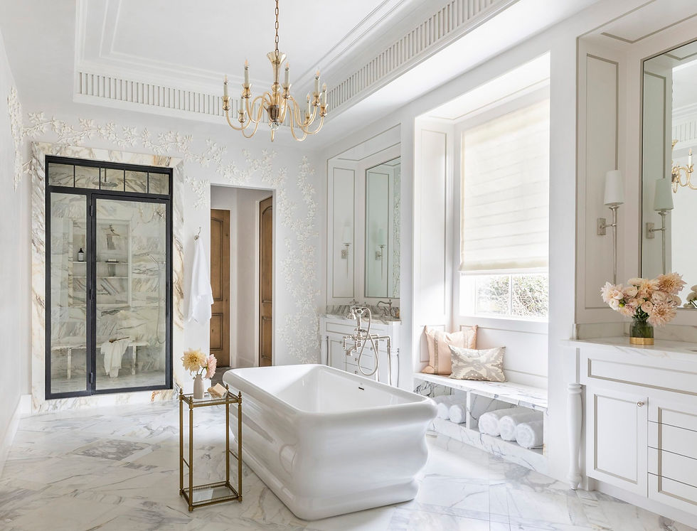 Elegant bathroom with white tub, gold chandelier, floral wall decor, and marble floor. Soft lighting creates a serene, luxurious vibe.