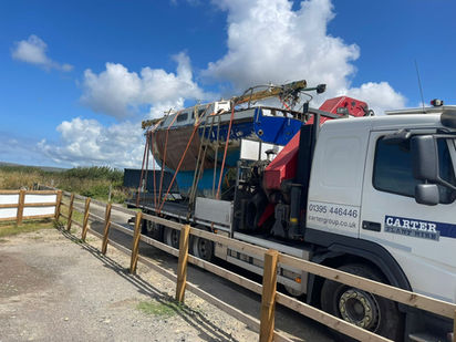 Carter Plant Hire lifting and transporting a salvaged boat
