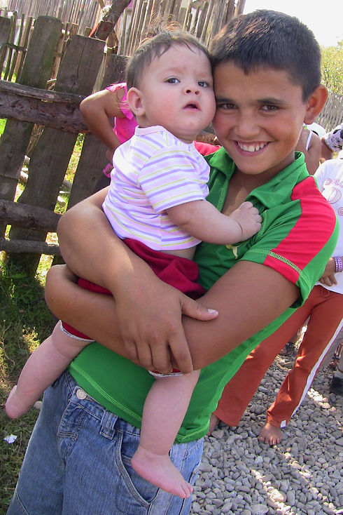 Roma teenage boy with baby.JPG