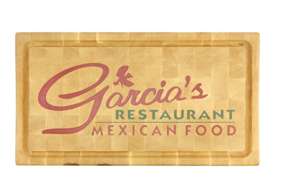 Garcia's restaurant with Mexican food logo engraved on an end grain maple cutting board inlaid with epoxy.