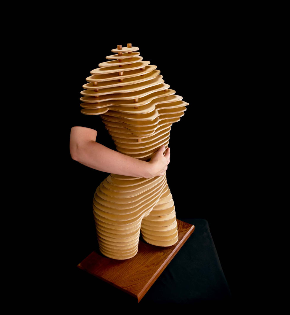 Artistic representation of a female torso using layered wood and dowels, highlighting structural depth and elegance.