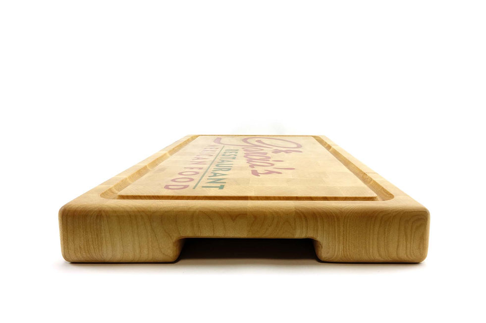 Mexican restaurant logo engraved on a maple end grain chopping board.