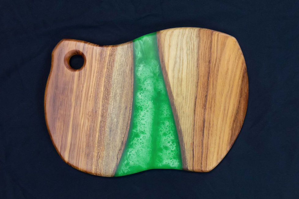 Beautiful hardwood pecan wood board with colorful epoxy river accent.