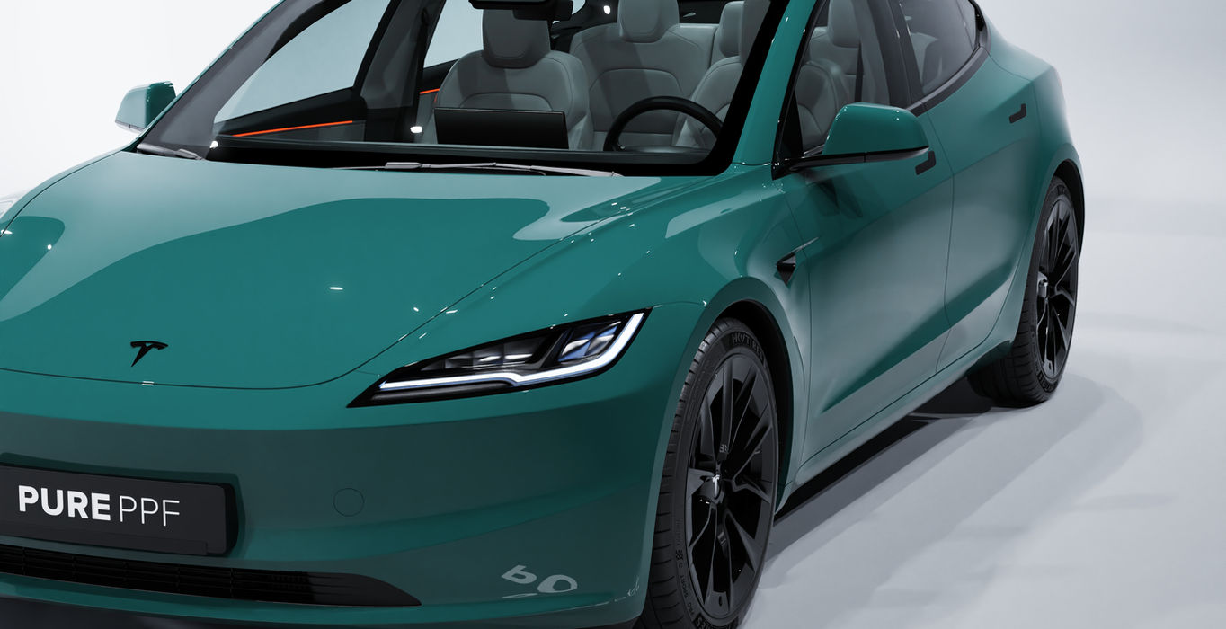 Front angle view of a Tesla Model 3 wrapped in PurePPF Venice Green, displaying the luxurious and elegant look of the green finish with blue undertones, resembling the late 80's inspired 'Murano' green.