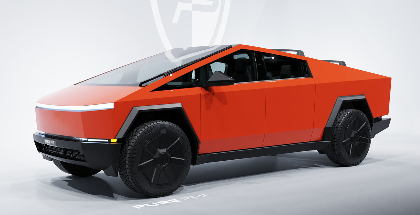 Side view of a Tesla Cybertruck wrapped in PurePPF Gloss Scarlet, highlighting the passionate and bold look of the rich red finish with hints of orange.