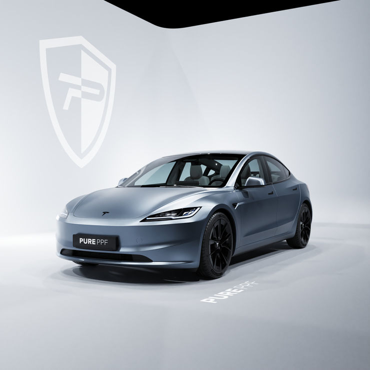 Front view of a Tesla Model 3 wrapped in PurePPF Satin Bullet, showcasing a sleek grey color with strong blue undertones and a satin finish.