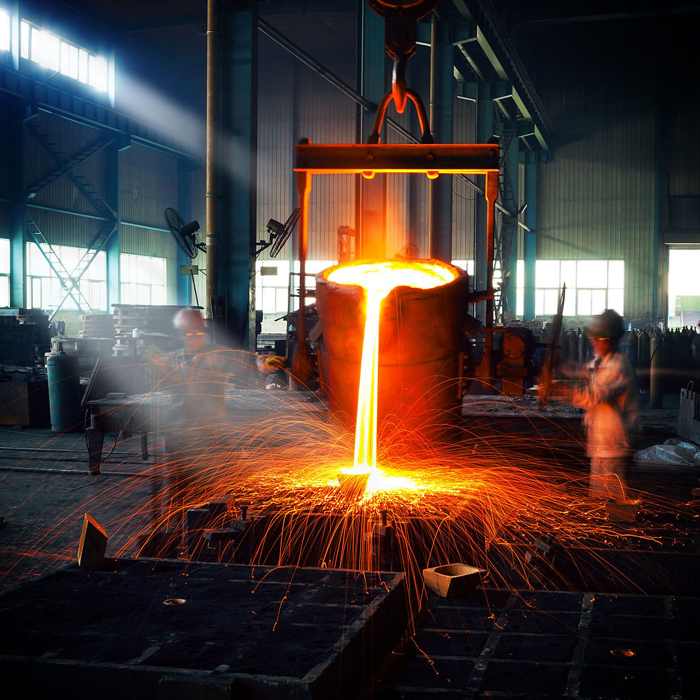 Recently refined molten steel is shown being poured into a mold by a factory worker.